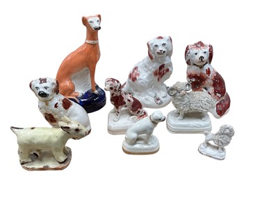 Lot 63 - Group of 19th century Staffordshire animals, including a miniature poodle, a pug, a ram, etc, together with a naive model of a goat