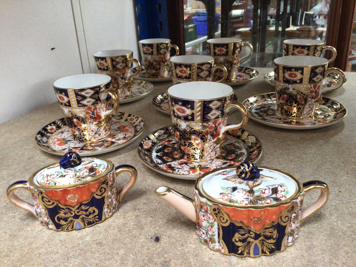 Lot 333 - Davenport Imari eight place coffee set, together with an Imari miniature teapot and sugar pot