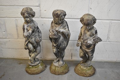 Lot 1498 - Set of three 19th century lead putti garden statues