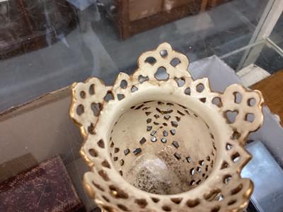 Lot 420 - Group of reticulated vases, possibly Zsolnay Pecs, together with a transfer printed two handled vase.