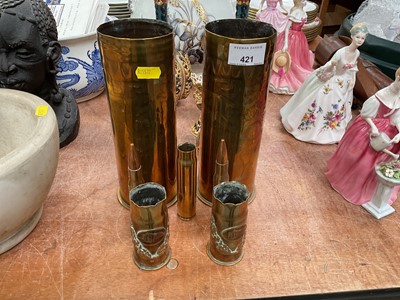 Lot 421 - Pair of First World War brass trench art vases with Japanese style decoration, together with other bullet cases and another pair of trench art vases.