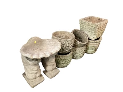 Lot 1428 - Six various concrete garden planters, together with a bird bath and two bench ends