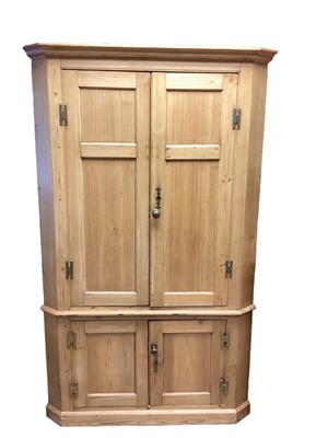 Lot 1416 - Antique pine two height corner cupboard with shelved interior enclosed by four panelled doors, 120cm wide, 65cm deep, 196.5cm high