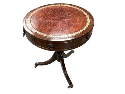 Lot 1417 - Reproduction mahogany drum table with inset leather lined top, together with a similar sofa table with single drawer (2)