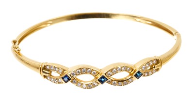 Lot 499 - Sapphire and diamond hinged bangle with a platted design of single cut diamonds and three blue sapphires in 18ct gold setting