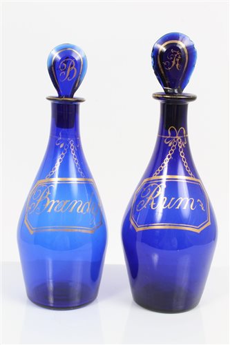 Lot 56 - Two late Georgian Bristol blue decanters with...