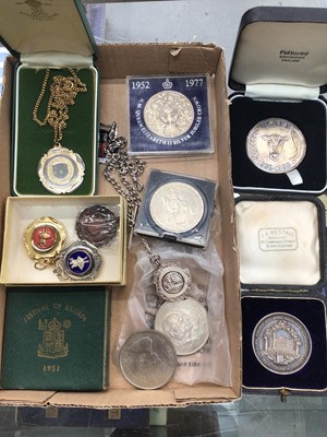 Lot 1098 - Two silver medallions in fitted cases, silver fob on plated chain, other fobs and coins