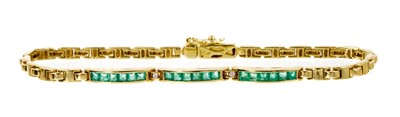Lot 536 - Emerald and diamond bracelet with three bands of calibre cut emeralds in channel setting interspaced by two small diamonds on articulated 14ct gold links, 19cm.