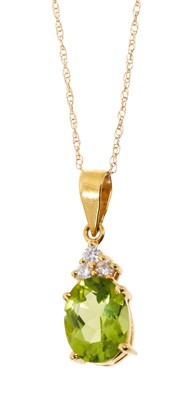 Lot 540 - Peridot and diamond pendant necklace with an oval mixed cut peridot measuring approximately 8.2 x 6.7mm surmounted by three brilliant cut diamonds in 18ct gold setting on 14ct gold chain.