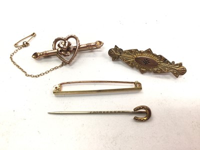 Lot 1104 - Two 9ct gold bar brooches, 9ct gold tie pin and a gold horseshoe stick pin