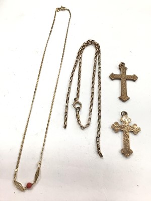 Lot 1105 - Two 9ct gold cross pendants, 9ct gold broken chain and 9ct gold chain with a coral bead