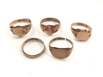 Lot 1107 - Four 9ct rose gold signet rings and 9ct rose gold wedding ring (5)