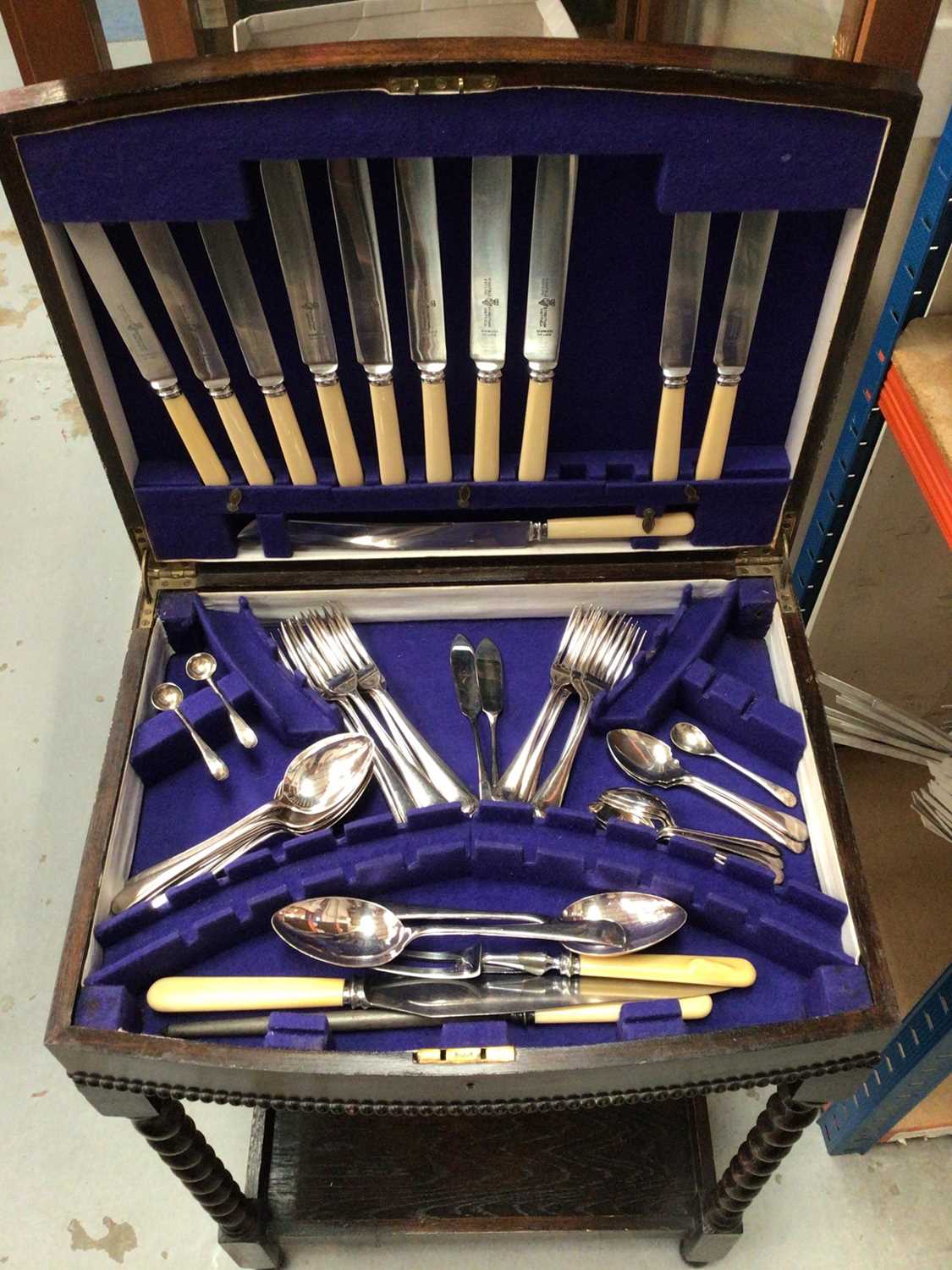 Lot 361 - Canteen of plated cutlery in an oak case on four barley twist legs