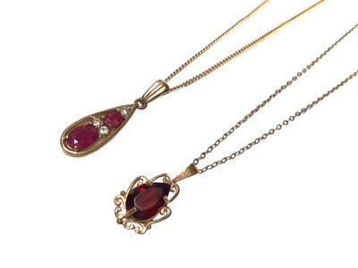 Lot 185 - Ruby and diamond pendant necklace, the pear shape drop with two oval mixed cut rubies and three brilliant cut diamonds in 9ct gold setting on 9ct gold chain together with a 9ct gold garnet single s...