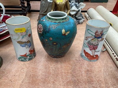 Lot 473 - Paid of Chinese cylinderical porcelain vases decorated with warriors together with another vase (3).