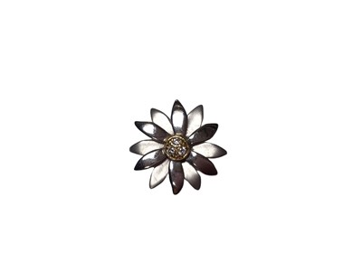 Lot 191 - 18ct white gold and diamond flower pendant with three brilliant cut diamonds to the centre and polished and matte white gold petals