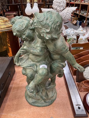 Lot 493 - Hollow cast metal garden ornament in the form of two children playing.