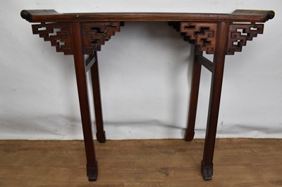 Lot 1517 - Antique Chinese hardwood altar table, the dished top with scrolled ends, raised on angular pierced brackets and square supports