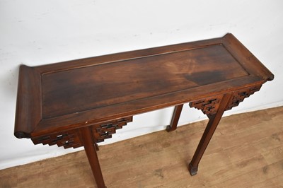 Lot 1517 - Antique Chinese hardwood altar table, the dished top with scrolled ends, raised on angular pierced brackets and square supports