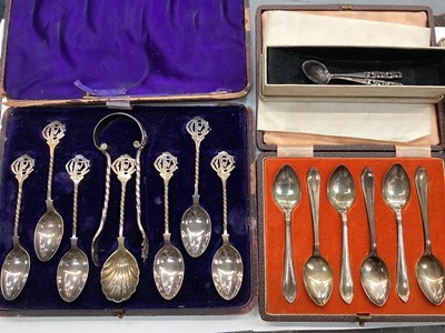 Lot 1116 - Two sets of silver teaspoons in fitted cases, other white metal spoons and some plated flatware