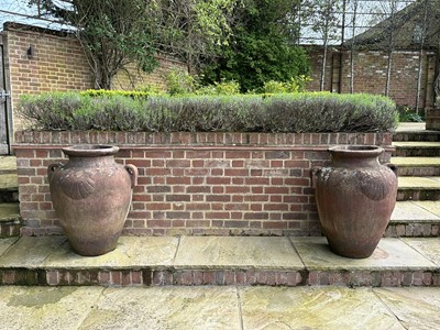 Lot 1496 - Set of four terracotta garden urns of Grecian form, 79cm high