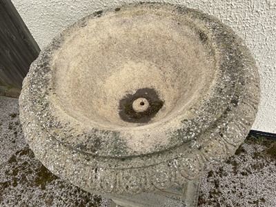 Lot 1550 - Large pair of reconstituted stone garden urms of campagna form with egg and dart rim, reeded bowl on socle bases with square plinths, 122cm high x 72cm diameter