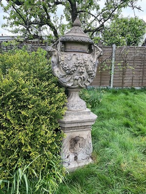 Lot 1557 - A fine antique reconstituted stone garden urn and cover on plinth, with detachable lid, female caryatid handles, floral festoons on socle base, the plinth with figures and acanthus leaves, approxim...