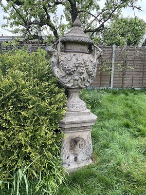 Lot 1557 - A fine antique reconstituted stone garden urn and cover on plinth, with detachable lid, female caryatid handles, floral festoons on socle base, the plinth with figures and acanthus leaves, approxim...