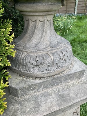 Lot 1557 - A fine antique reconstituted stone garden urn and cover on plinth, with detachable lid, female caryatid handles, floral festoons on socle base, the plinth with figures and acanthus leaves, approxim...