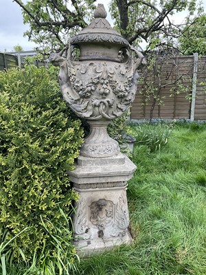 Lot 1557 - A fine antique reconstituted stone garden urn and cover on plinth, with detachable lid, female caryatid handles, floral festoons on socle base, the plinth with figures and acanthus leaves, approxim...