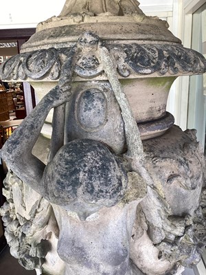 Lot 1557 - A fine antique reconstituted stone garden urn and cover on plinth, with detachable lid, female caryatid handles, floral festoons on socle base, the plinth with figures and acanthus leaves, approxim...