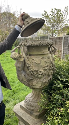 Lot 1557 - A fine antique reconstituted stone garden urn and cover on plinth, with detachable lid, female caryatid handles, floral festoons on socle base, the plinth with figures and acanthus leaves, approxim...