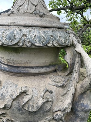 Lot 1557 - A fine antique reconstituted stone garden urn and cover on plinth, with detachable lid, female caryatid handles, floral festoons on socle base, the plinth with figures and acanthus leaves, approxim...