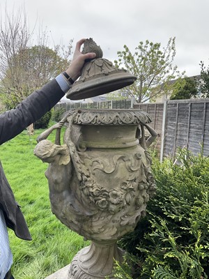 Lot 1557 - A fine antique reconstituted stone garden urn and cover on plinth, with detachable lid, female caryatid handles, floral festoons on socle base, the plinth with figures and acanthus leaves, approxim...