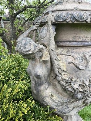 Lot 1557 - A fine antique reconstituted stone garden urn and cover on plinth, with detachable lid, female caryatid handles, floral festoons on socle base, the plinth with figures and acanthus leaves, approxim...