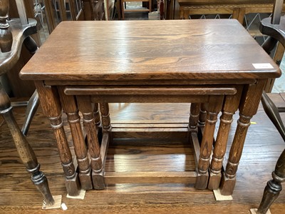 Lot 1304 - Oak nest of three occasional tables, together with a hanging cabinet (2)