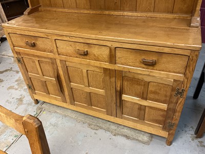 Lot 1529 - Suite of Derek 'Fishman' Slater blond oak dining furniture, comprising high dresser, adzed refectory table and set of six chairs (including two carvers) and hostess trolley (converting to two cof...
