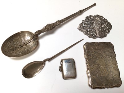 Lot 89 - Group of silver items to include a Victorian card case, Victorian buckle with pierced putti and scroll decoration, a vesta case and two spoons