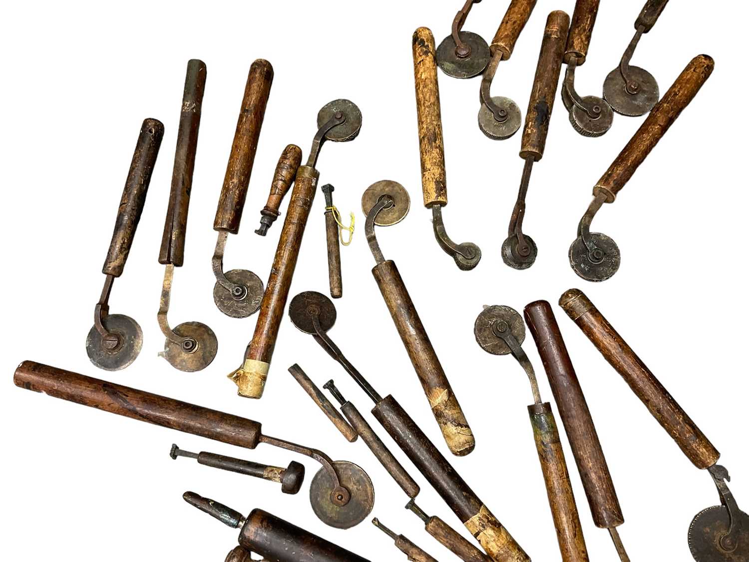 Lot 1532 - Set of 19th century leather working revolving stamps, designed for tooling leather furniture surfaces, approximately 23