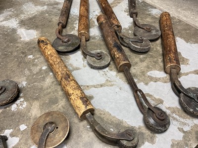 Lot 1532 - Set of 19th century leather working revolving stamps, designed for tooling leather furniture surfaces, approximately 23