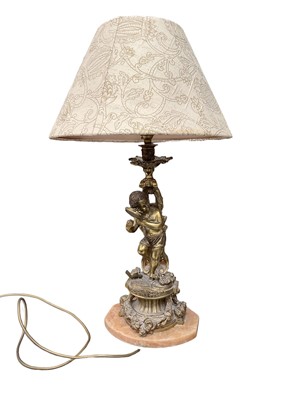 Lot 550 - Ormolu style cherub lamp with shade, total height 63cm