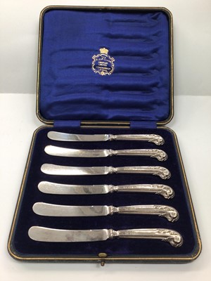 Lot 1034 - Cased set of six silver handled butter knives (Sheffield 1914)