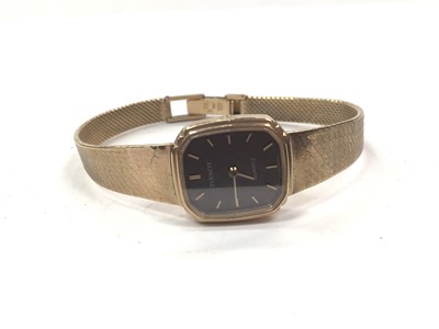 Lot 1040 - 9ct gold Tissot quartz wristwatch on an integral 9ct gold bracelet