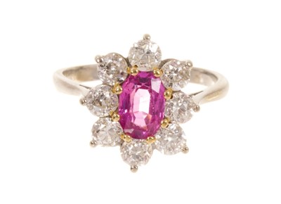 Lot 545 - Pink sapphire and diamond cluster ring