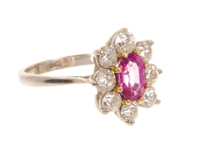 Lot 545 - Pink sapphire and diamond cluster ring