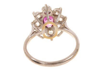 Lot 545 - Pink sapphire and diamond cluster ring