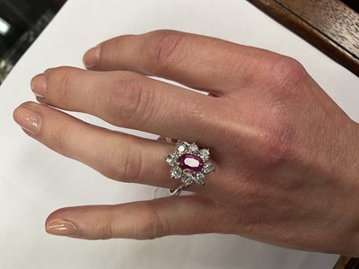 Lot 545 - Pink sapphire and diamond cluster ring