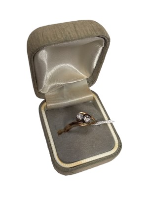 Lot 19 - Diamond two stone cross over ring
