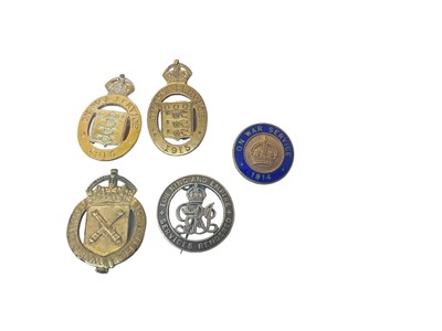 Lot 710 - First World War Silver War Badge numbered 338093 together with four First World War On War Service badges (5)