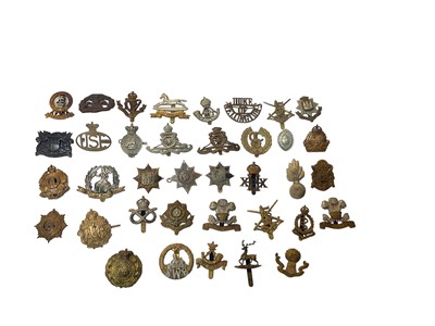 Lot 716 - Collection of military cap badges including Norfolk Regiment, Royal Artillery, Durham Light Infantry and others.